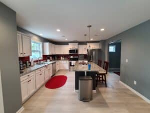 white-cabinets-with-black-island-and-white-trim-kitchen-cabinet-painting-cabinet-refinishing-trucare-painters