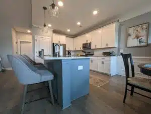 white high gloss kitchen cabents and soft grey island, cabinet painting services, trucare painters